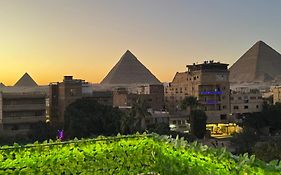 Nefertiti Pyramids View